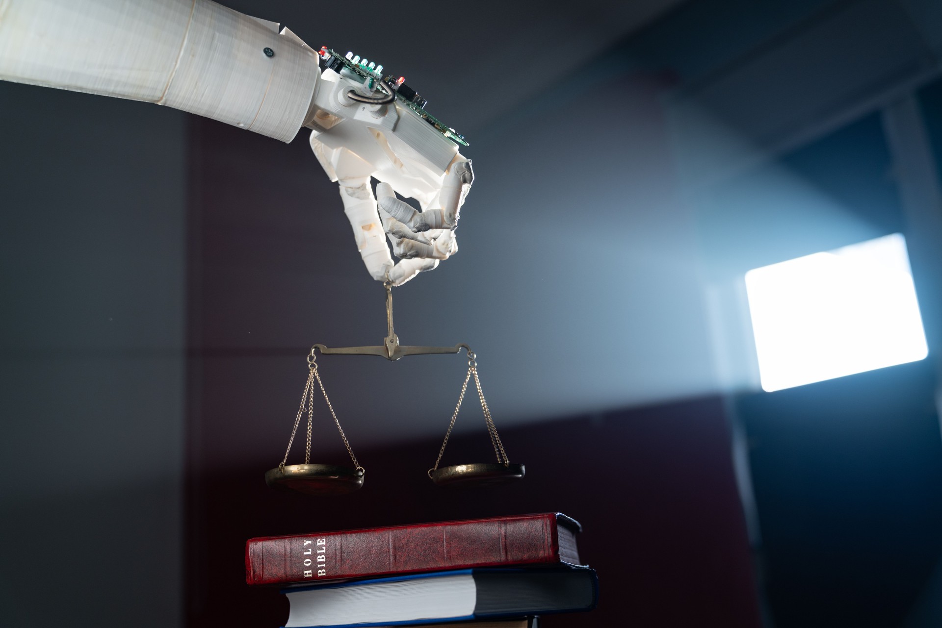 Robotic Hand Holding Scales of Justice On Holy Bible
